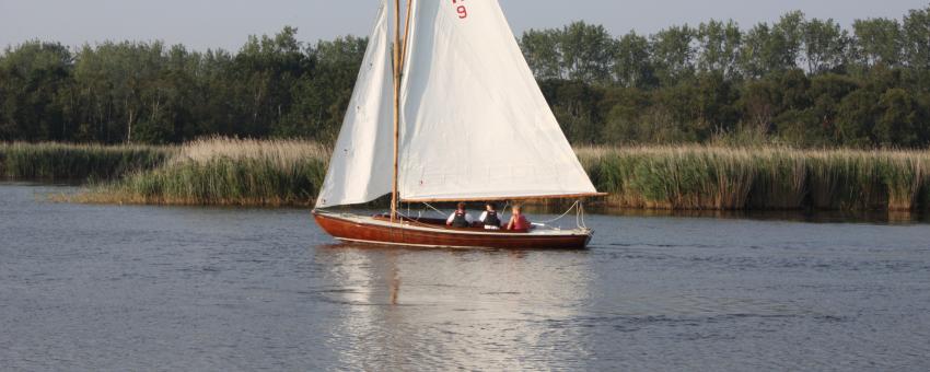 Yachting on Horsey Mere in late summer afternoon