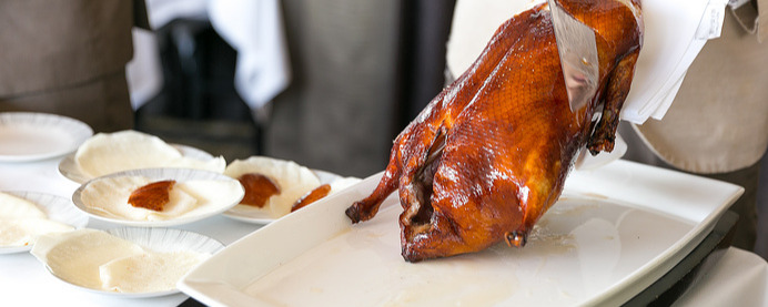 Cutting the Peking Duck skin tableside